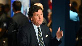 Tucker Carlson posts first photo with Putin